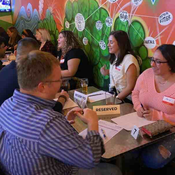 Attendees at a AL speed dating event